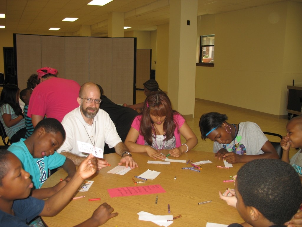 Matt, one of our postulants, helps the kids make their Gifts of the Holy Spirit links.