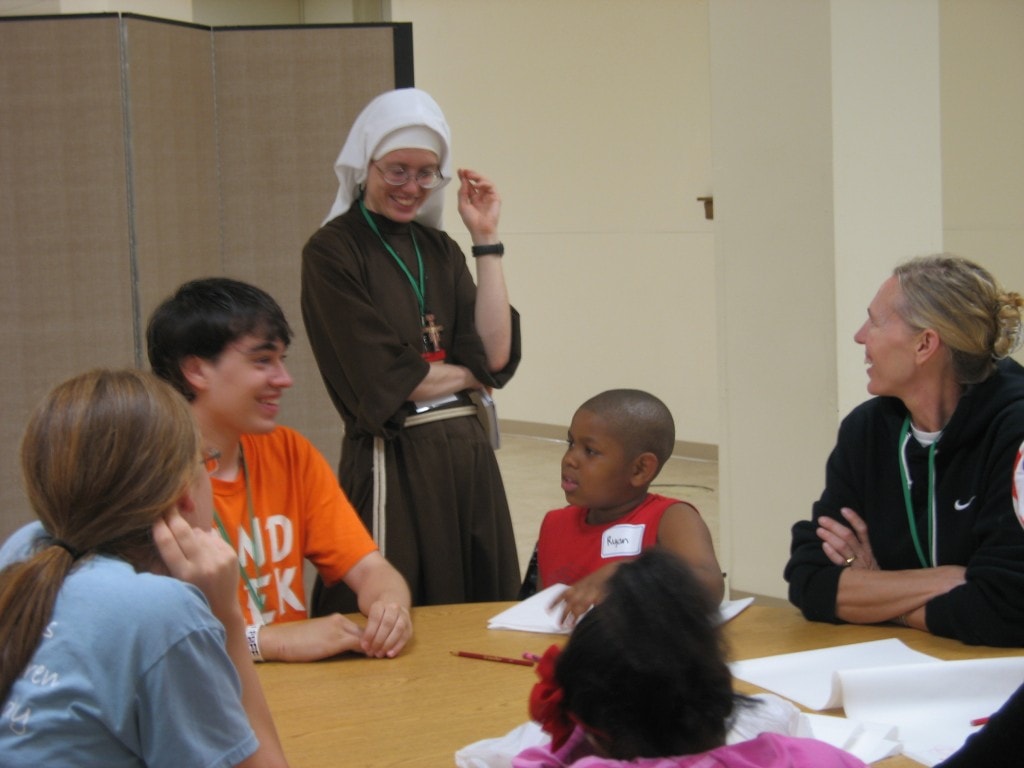 Sr. Stephanie and kids at craft tables